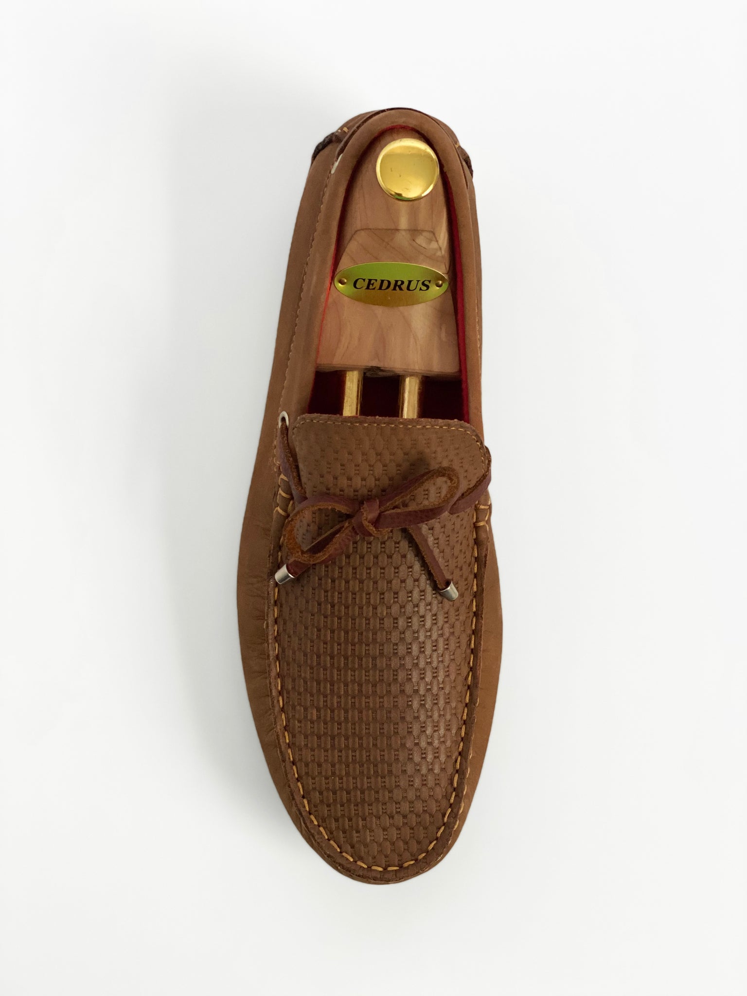 The Classic Tan Moccasin Leather Slipper Shoe With Sheepskin Lining, Rubber Soles, Leather Shoelaces, Whipstitch Details At Toe, Classic Woven Styling, And Moc-toe moccasin with saddle bit. The Moccasin is made entirely out of the softest, most comfortable, breathable and durable leather. Jebranco New York NYC. Men Moccasin Slipper Shoe, Man Moccasin Slipper Shoe, Boat Shoe, Leather Shoe, NYC Shoe Store, NYC Online Shoe Store, Slippers, Slipper Shoe. Custom Made Shoe In NYC. Tan Moccasin Slipper Shoe.